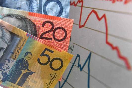 Australian currency is seen next to a wages graph