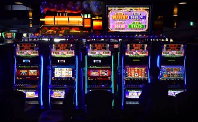A man sits at a poker machine in the gaming room at the Vikings Club in Canberra, Australia. Despite having less than half a percent of the world's population, Australia is home to a fifth of the world's slot machines.