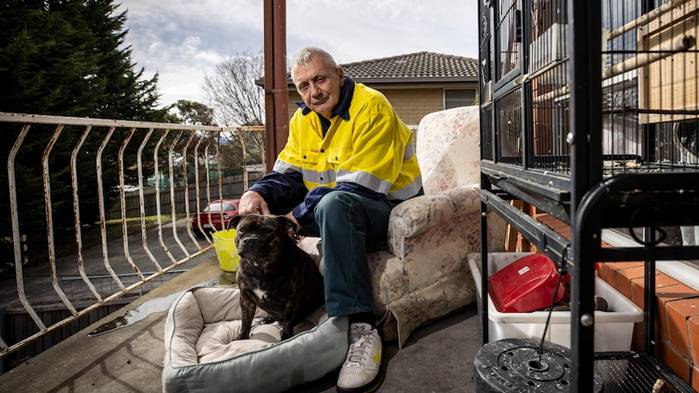 Tony Bull with his dog Princess at his Hobart rental property 