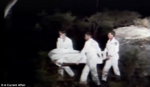 Officers carry one of serial killer Ivan Milat's victims from the Belanglo Forest in NSW, which lies just 72km north-west of Goulburn prison where Milat now resides in a Supermax cell in which he will remain until he dies 