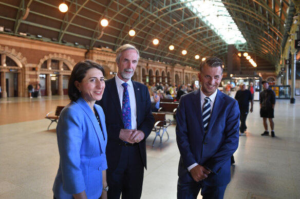 Then premier Gladys Berejiklian with Professor Andrew McNaughton and then transport minister Andrew Constance, announcing the review in 2018.